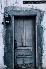 old wooden door with blue door