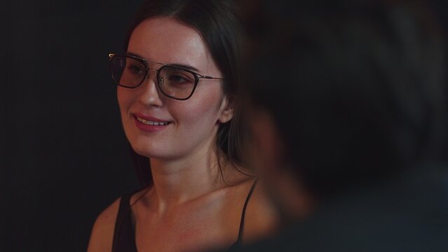 Portrait of drinking cocktail beautiful woman engaging conversation with friend or couple at back side at luxurious counter. Capturing essence social upscale interaction scene at night life. Vinosity. - Powered by Adobe