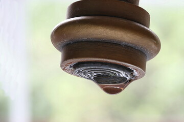 A drop of water on the mixer aerator. Aerator for the faucet