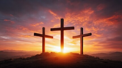 Three crosses on hill at sunrise with dramatic sky and sun rays