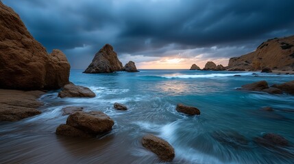 Serene Coastal Scene: The tranquil water gently laps against the shore and the vast expanse of the ocean under the dark cloudy sky. A sense of peace in a captivating coastal landscape.