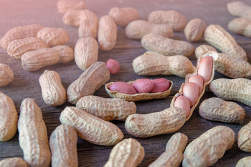 Ground peanuts on wood background ,ingredient food.