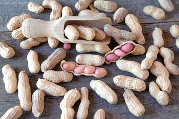 Ground peanuts on wood background ,ingredient food.