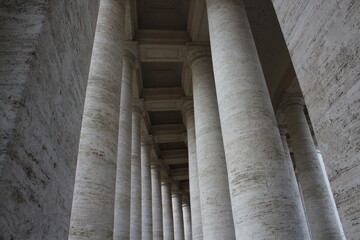 Columned hallway in Saint Peter-s Square. Beautiful ancient architecture with huge marble pillars...