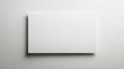 Blank white paper sheet on a plain white background with subtle shadows for a clean and minimal design