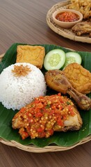 Spicy Ayam Geprek with Sambal on Banana Leaf Plate
