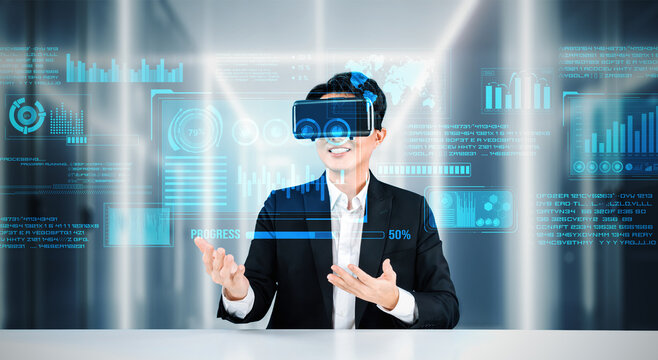 Smart project manager looking and holding business data and checking financial chart. Smart business man wearing augmented reality goggles by using artificial intelligence planning plan. Ingenuity. - Powered by Adobe
