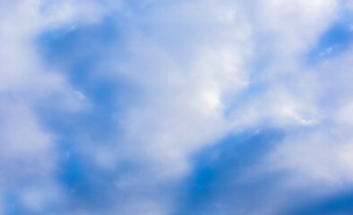 Beautiful blue sky and white fluffy group of clouds background in the morning skyline
