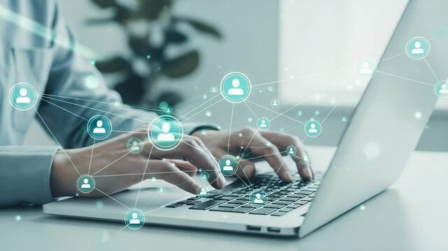 Typing on laptop with social network connections and icons overlayed on the keyboard area view - Powered by Adobe