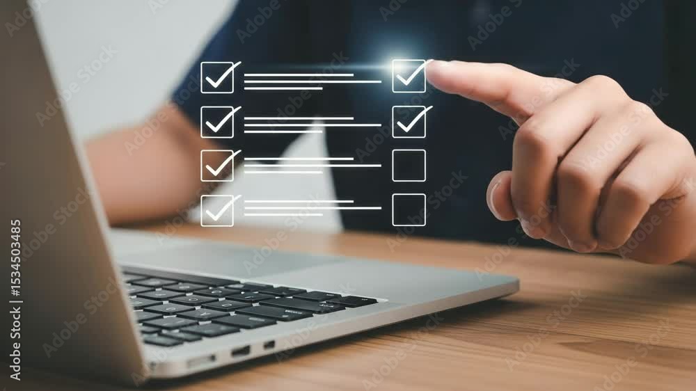 Poster person using laptop to complete digital checklist with hand selecting options on screen view
