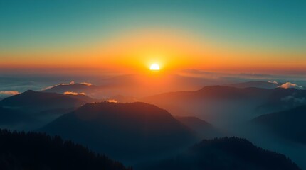 Obraz premium Golden sunrise casting light over misty mountain ridges