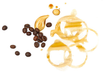 Spilled instant coffee foam, stains with circle print and coffee beans, isolated on white background, top view