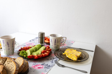 Good breakfast on a fork with vegetables and bread