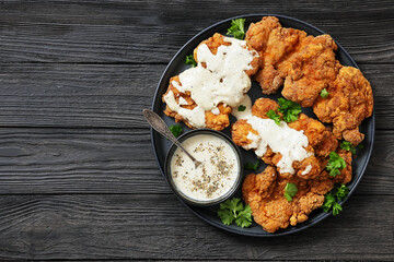 Deep fried Southern chicken thighs with milk gravy