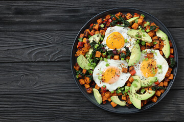 fried sweet potato cubes, eggs, and fresh avocado