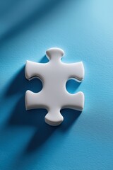 Obraz premium White puzzle piece on blue surface with dramatic shadowing