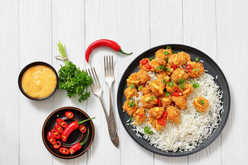 panko-breaded chicken bites with rice and sauce