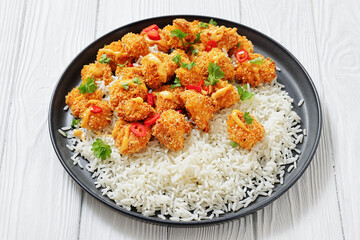 panko-breaded chicken bites with rice and sauce