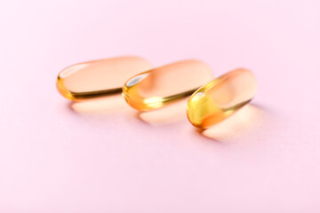 Fish oil capsules with omega 3 on bright background. Concept for a healthy dietary supplementation....