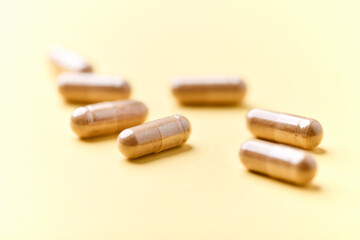 Carnitine capsules. Concept for a healthy dietary supplementation. Bright paper background. Soft focus. Close up.	