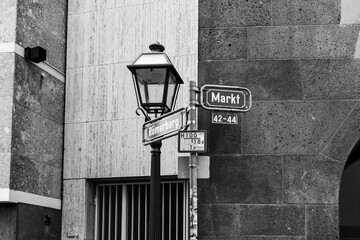 Frankfurt old town street sign leading to Markt and Romerbeg in black and white
