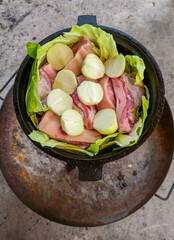 Preparing a dish in a cauldron - step by step.