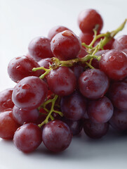 Fototapeta premium Red Grapes with Water Droplets on White Background