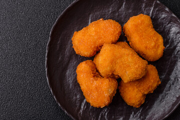 Chicken nuggets in breading, takeaway food, junk food