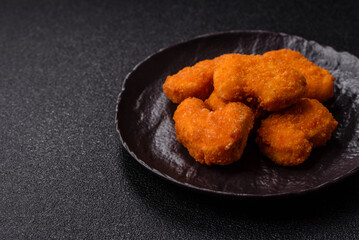 Chicken nuggets in breading, takeaway food, junk food