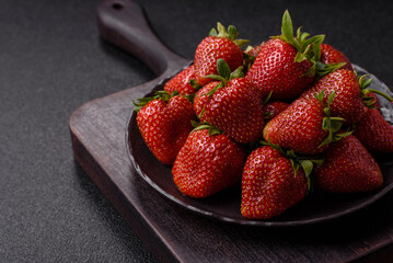 Strawberry, fresh juicy berries and fruits as background