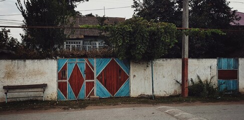 Old garden gates in the village with patterns on it