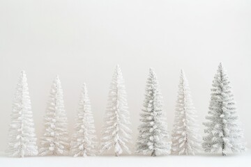 Obraz premium Festive Faux Christmas Trees on Display. Holiday Decor for Sale in a Bright White Market Background