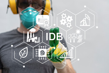 Worker using virtual touch screen push text: IDB. IDB - Industrial Development Bond Modern Industry Business Concept.