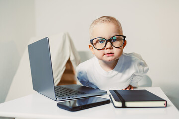 Stylish 2 year old boy child in office. Serious little children business man. Young toddler...