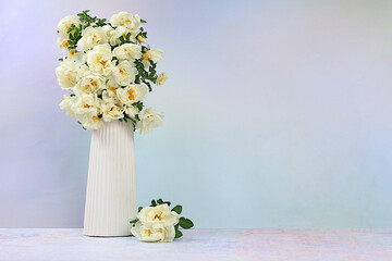 Still life with beautiful flowers of cream rose and rose hips on elegant modern table,Abstract flower arrangement. template for your design with place for text, minimalist beauty concept