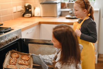 Baking cookies in a cozy kitchen with a child during a weekend afternoon