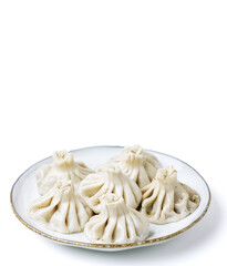 Plate with traditional georgian khinkali (dumplings) isolated on white background. Side view, copy space. Vertical orientation,