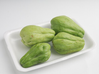Fresh chayote on white background