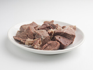 Boiled beef lungs on white plate