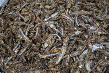 Mixed dried fish are displayed and sold at a fish market. Different types of dried fish along with hilsa are sold by a street vendor. All types of dried salted fish in the Asian biggest seafood market
