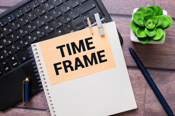 Time to renew , text in a gold frame on a pink background, near an alarm clock