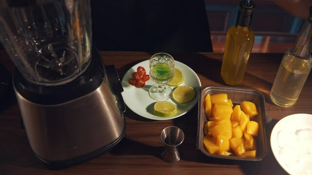 Spicy mango margarita preparation 1 stage adding ingredient