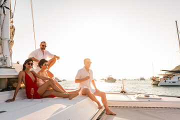 Happy Caucasian man and woman travel nature the sea on luxury catamaran boat yacht on summer beach...