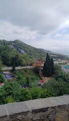 Chefchaouen blue city evening view from the hill with blue houses and street lamps light in Morocco with soft focus