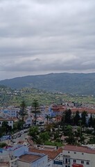 Chefchaouen blue city evening view from the hill with blue houses and street lamps light in Morocco...