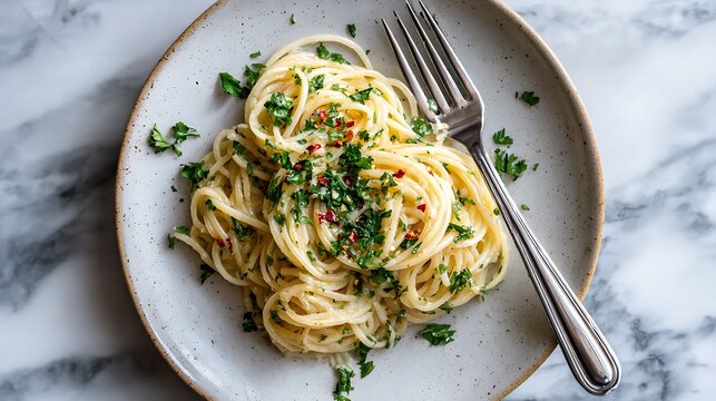 Spaghetti with Garlic and Herbs on a Marble Background