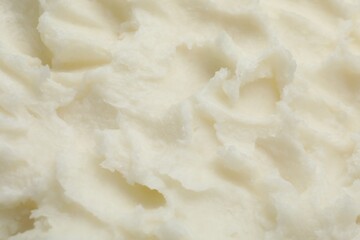 Texture of organic shea butter as background, top view
