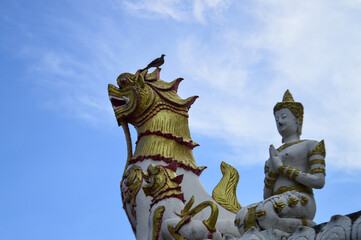 Thai Angel Statue and Statues of Lion Guarding temples, Symbols of Buddhism, Southeast Asia at Chiang Yuen temple, Mueang Chiang Mai, Chiang Mai, Northern Thailand
