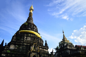 Fototapeta premium Old Pagoda in the Evening, Ancient Architecture, Symbols of Buddhism, South East Asia at Pa Pao temple, Mueang Chiang Mai, Chiang Mai, Northern Thailand