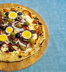 Original Brazilian pizza with olives, mushrooms, grated pepperoni, onion, red pepper, oregano and extra virgin olive oil